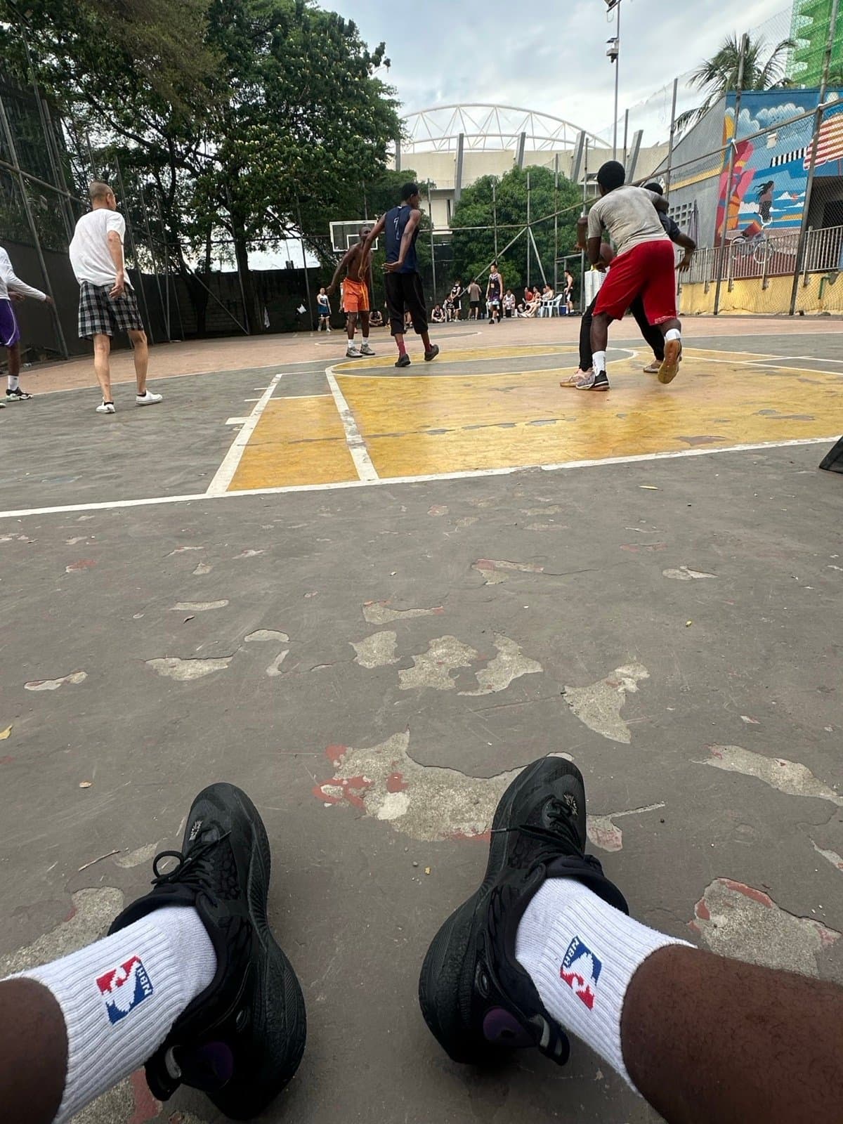 Playing pickup basketball outdoors
